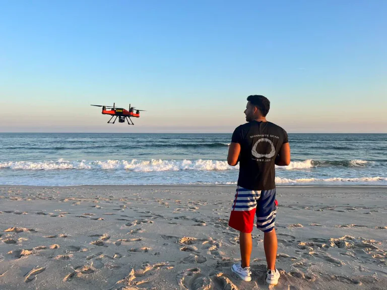 man flying swellpro drone